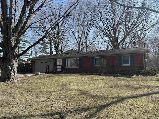 single story home featuring a front lawn, an attached garage, fence, and brick siding