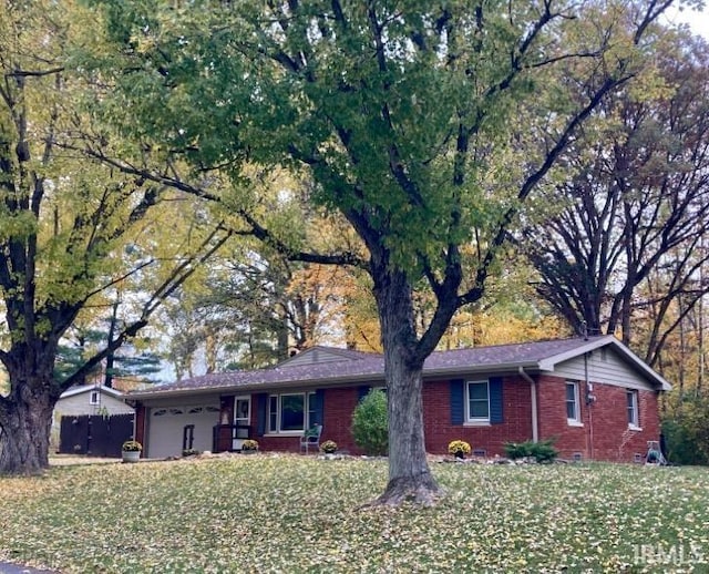 ranch-style home featuring brick siding