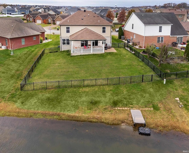 aerial view with a residential view and a water view