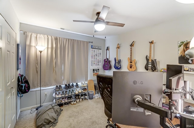 misc room featuring carpet, a ceiling fan, and visible vents