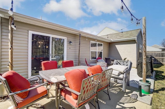 view of patio / terrace with outdoor dining space and fence