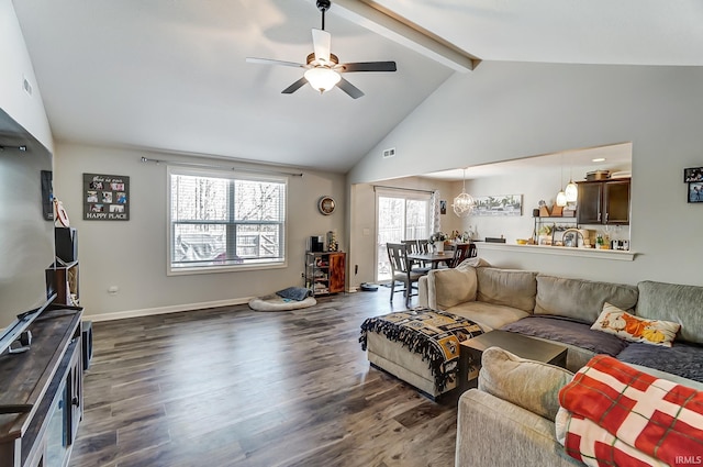 living room featuring dark wood-type flooring, vaulted ceiling with beams, baseboards, and ceiling fan