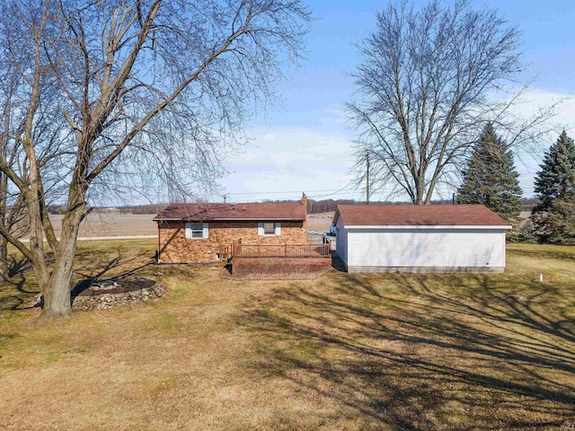 view of yard featuring an outbuilding and a deck