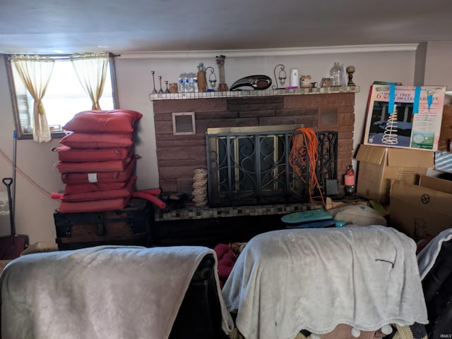 living area with visible vents and a brick fireplace