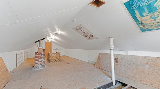 additional living space featuring lofted ceiling