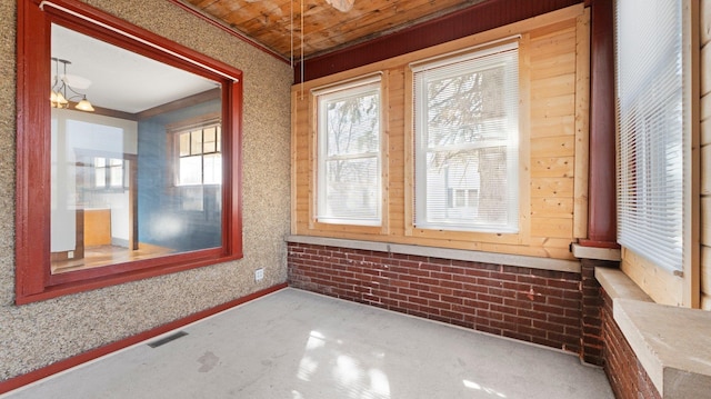 unfurnished sunroom with visible vents