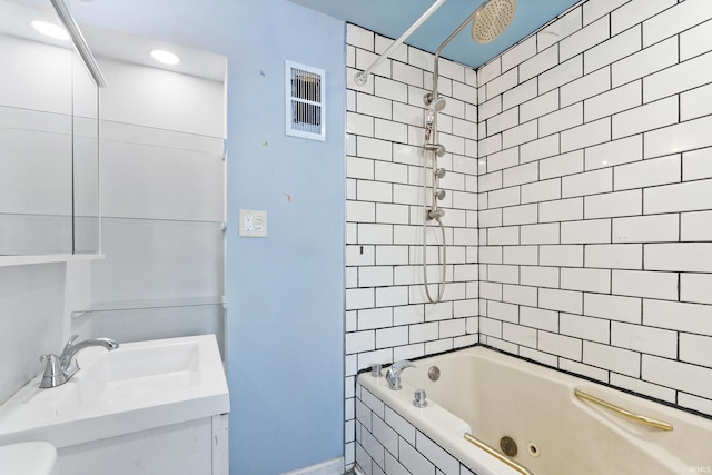 full bath with visible vents, a combined bath / shower with rainfall shower, and vanity