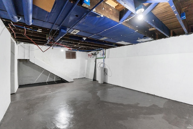 unfinished basement featuring visible vents