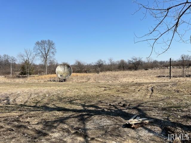 view of yard with a rural view