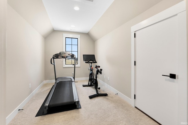 exercise area featuring light carpet, recessed lighting, baseboards, and vaulted ceiling