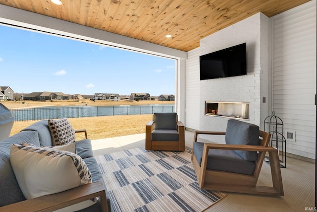 view of patio with an outdoor living space and fence