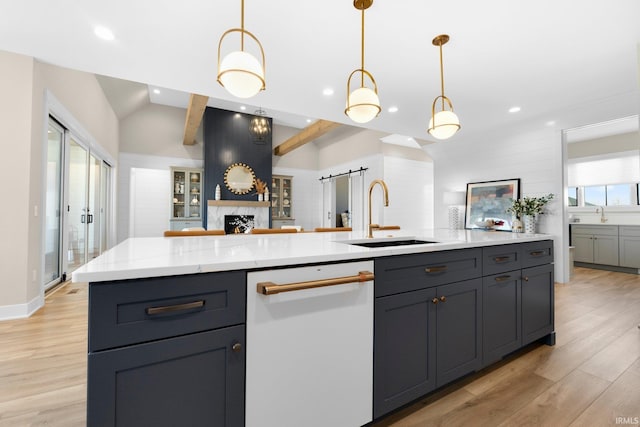 kitchen with light wood-style flooring, recessed lighting, a sink, dishwasher, and open floor plan