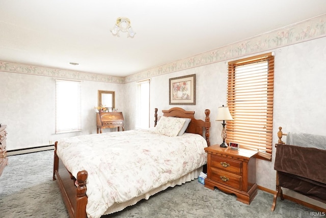 bedroom with baseboards, carpet, and a baseboard radiator