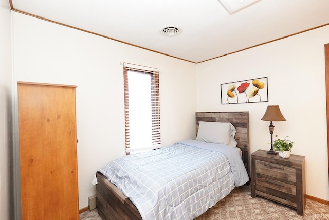 bedroom featuring carpet flooring, baseboards, visible vents, and ornamental molding