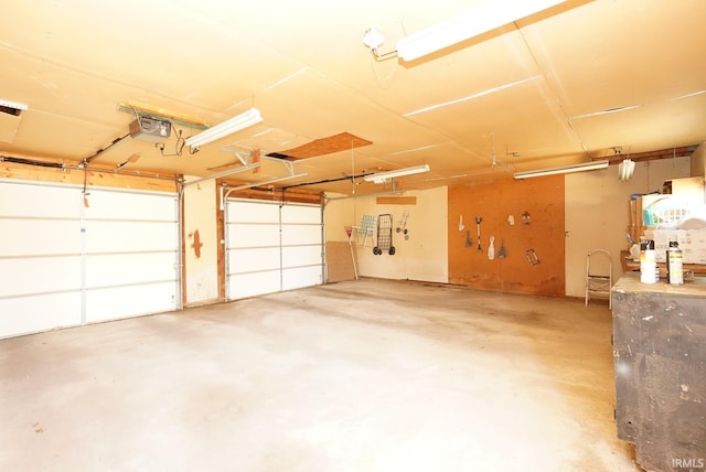 garage featuring a garage door opener