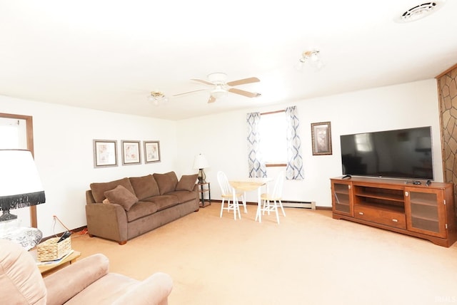 living room featuring baseboard heating, baseboards, carpet, and ceiling fan