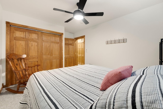 bedroom featuring a closet, light carpet, and ceiling fan