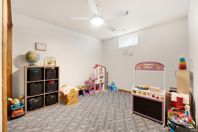 game room featuring a ceiling fan, visible vents, and carpet floors