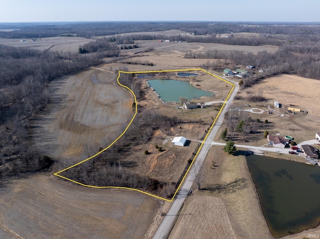 drone / aerial view with a rural view and a water view