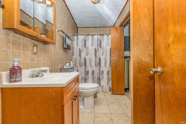 bathroom with tile patterned floors, curtained shower, toilet, and tile walls