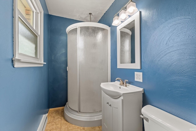 bathroom with vanity, baseboards, a shower stall, tile patterned floors, and toilet