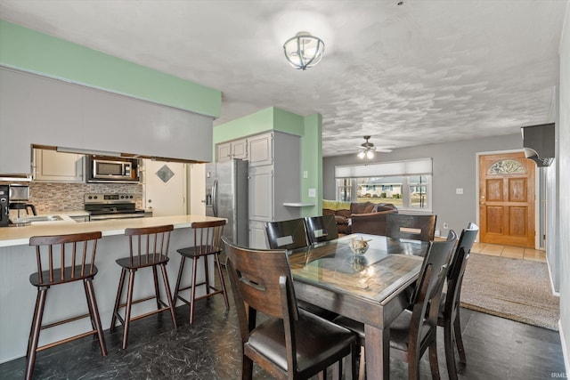 dining space featuring a ceiling fan