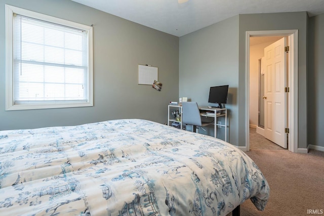 carpeted bedroom featuring baseboards