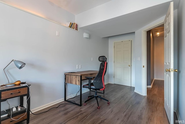 office space with baseboards and wood finished floors