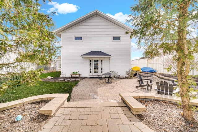 back of house featuring a patio and fence