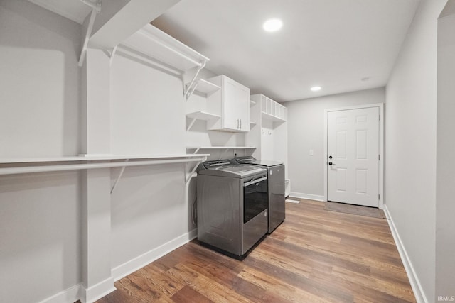 clothes washing area featuring recessed lighting, baseboards, independent washer and dryer, and light wood finished floors