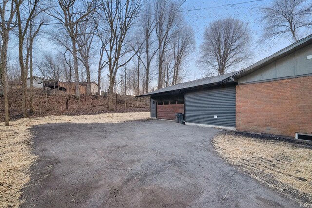 garage featuring driveway