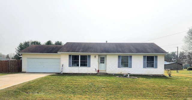 ranch-style home with entry steps, fence, concrete driveway, a front yard, and a garage