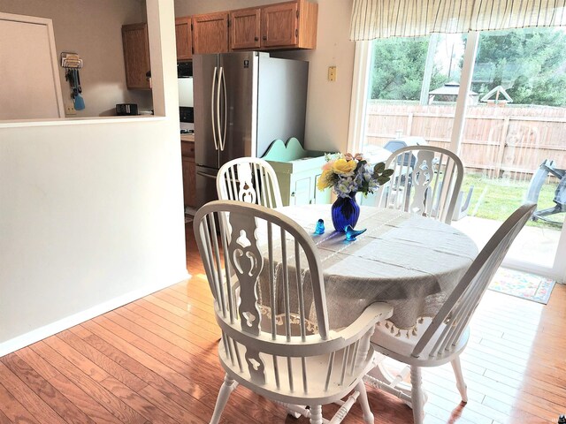 dining room with hardwood / wood-style floors