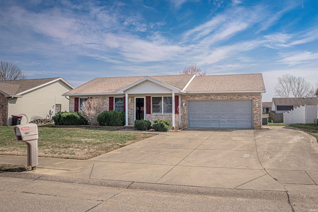 ranch-style house featuring brick siding, a front yard, roof with shingles, driveway, and an attached garage