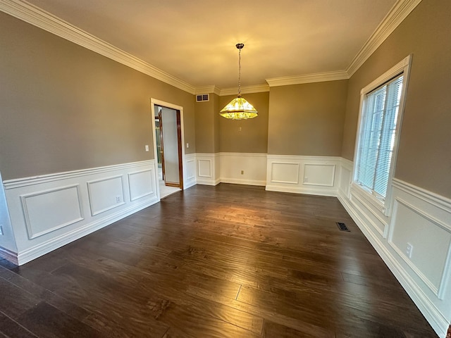 spare room featuring visible vents, ornamental molding, and dark wood-style flooring