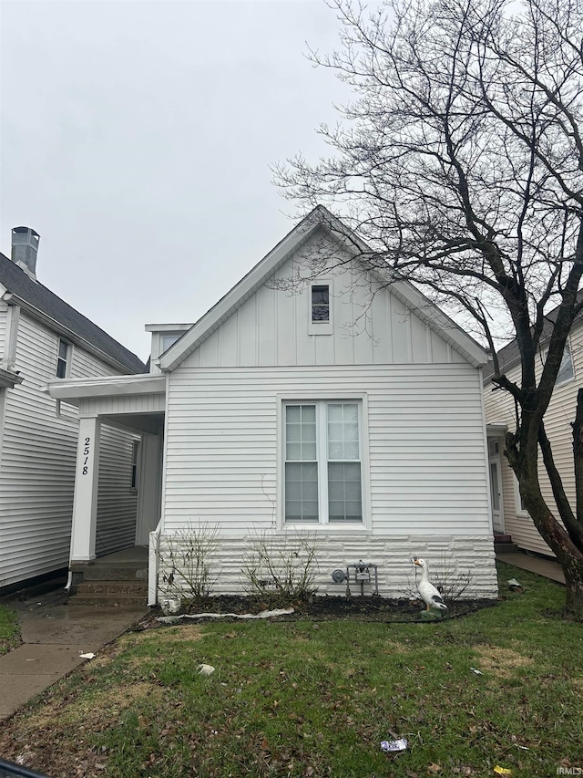 view of property exterior featuring a yard and board and batten siding