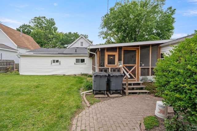 1015 W Jefferson St, Kokomo, IN 46901 - rear view of property with a sunroom and a patio