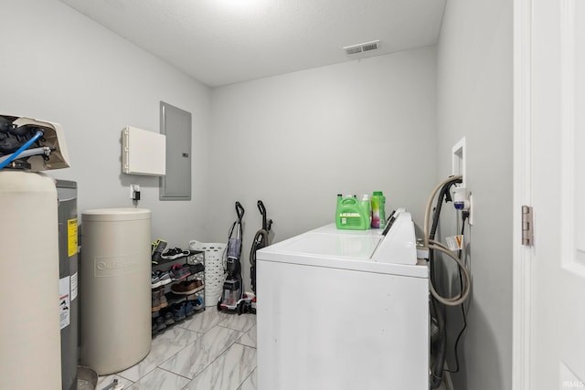 clothes washing area featuring visible vents, marble finish floor, washer and dryer, electric panel, and laundry area