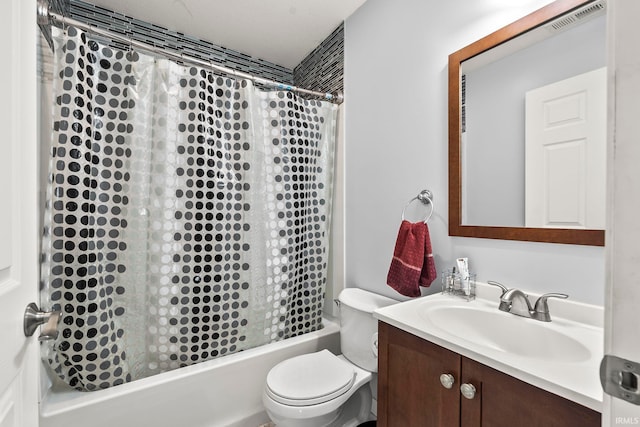 full bathroom featuring vanity, shower / bath combo with shower curtain, toilet, and visible vents