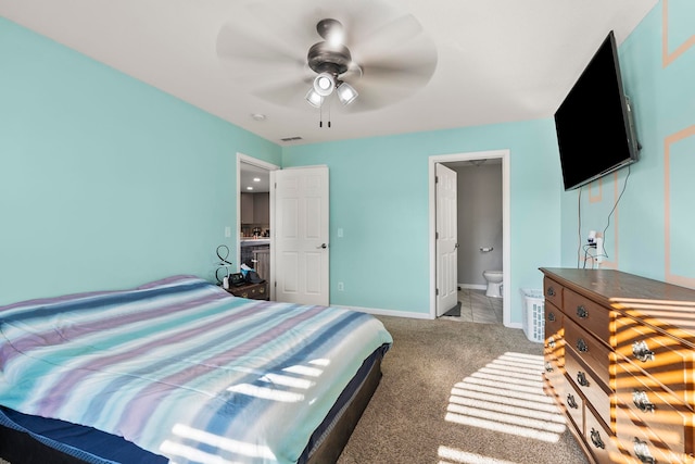 bedroom featuring visible vents, ensuite bathroom, carpet, baseboards, and ceiling fan