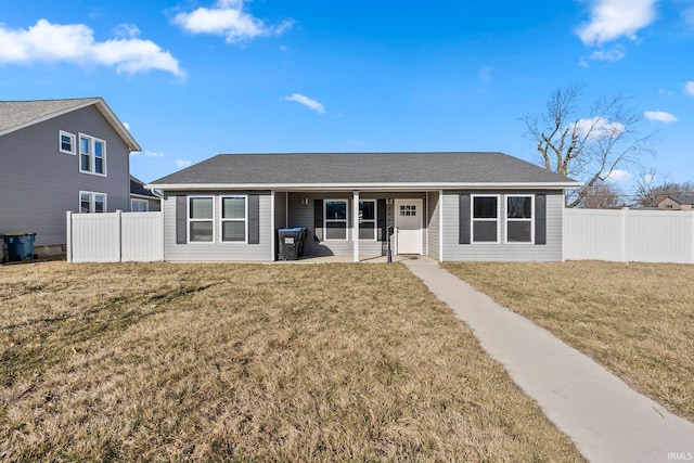 single story home with a front yard, fence, and roof with shingles