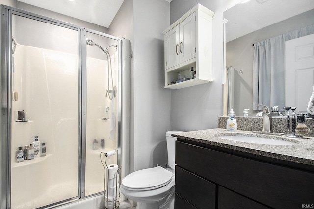 full bathroom with vanity, toilet, and a stall shower