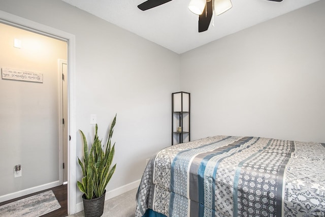 bedroom featuring baseboards and ceiling fan