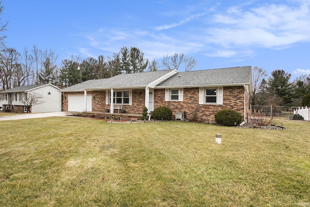 ranch-style home with brick siding, fence, a front yard, a garage, and driveway