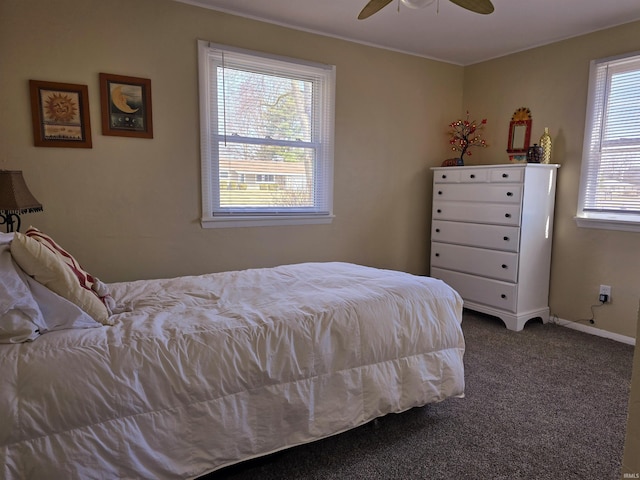 bedroom with baseboards, a ceiling fan, and carpet flooring