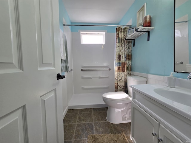 full bathroom with vanity, toilet, and a shower with shower curtain