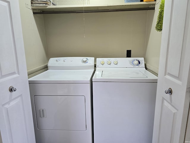 clothes washing area featuring laundry area and independent washer and dryer