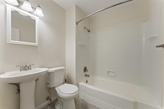 full bath featuring tile patterned flooring, baseboards, toilet, shower / bathtub combination, and a sink