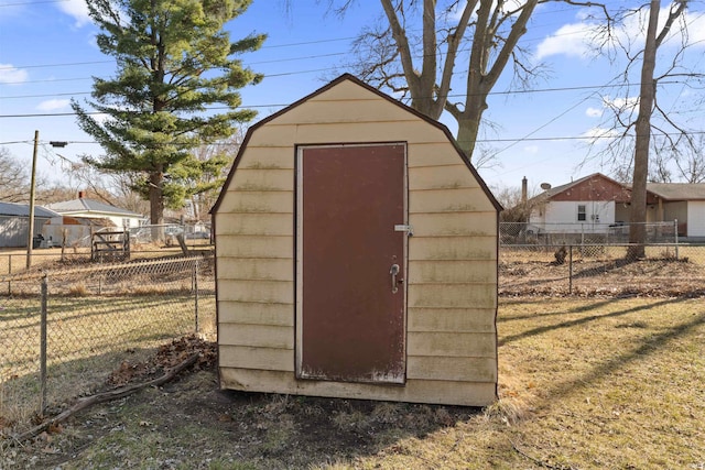 view of shed featuring fence