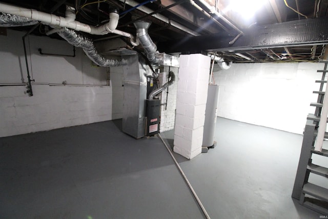 unfinished basement featuring gas water heater and heating unit